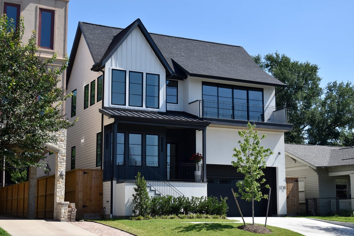 Luxurious modern single-family homes in an affluent neighborhood under a clear sky